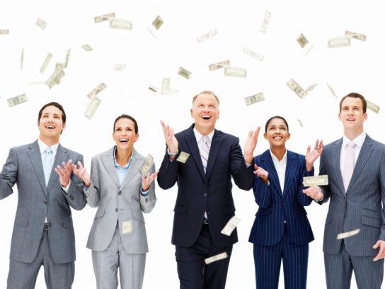 photo of business people in suits with paper money floating down